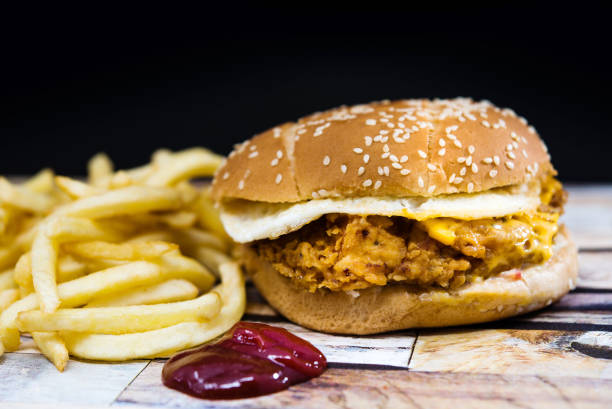 istock Cheese burger - American cheese chicken burger with fresh salad 923229824