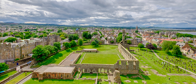 The town of St Andrews seen from the St Rule's tower. You can see the ruins of the Cathedral, built in 1158, and the ruins of the Castle, dating to the 1200s. St Andrews, Fife, Scotland.