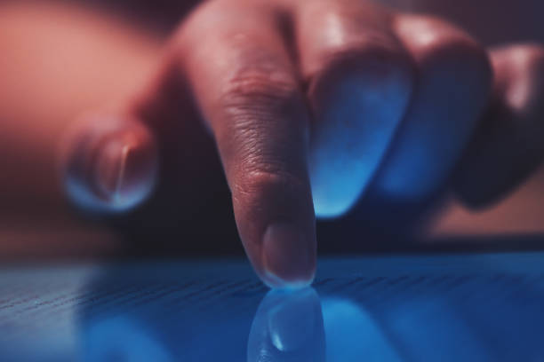 istock Extreme close up of female finger using digital tablet 923241608