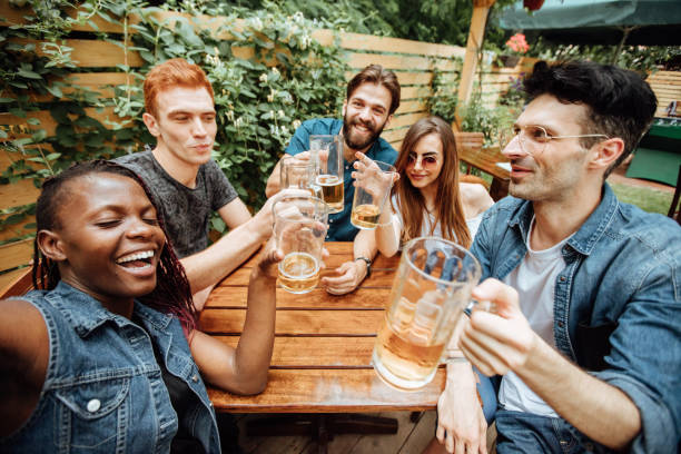 istock Happy friends making toast and taking selfie 923241642