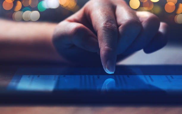 istock Woman reading online news on digital tablet 923241676