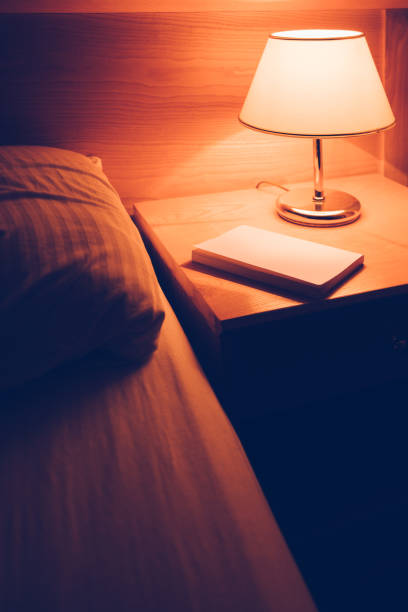 istock Book and vintage lamp on night table 923241754