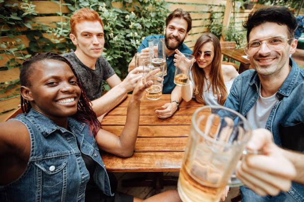 istock Happy friends making toast and taking selfie 923244078