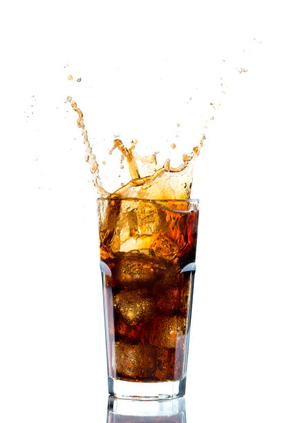 istock Ice splashing on a glass of a Cola drink 923244082