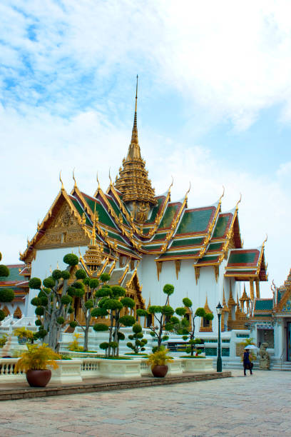 Bangkok, Thailand - June 26, 2017: After exitting the Wat Phra Kaeo, visitors from all over the word wander in front of the Chakri Maha Prasat Hall and take pictures and selfies. Grand Palace.