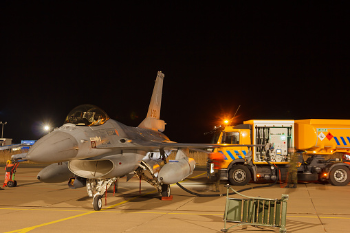 Leeuwarden Netherlands, Feb 6 2018: Night flying Exercise of the RNLAF. F-16 Fighting Falcon is being refueled for the next flight at the platform of Leeuwarden Air Base in the Netherlands.