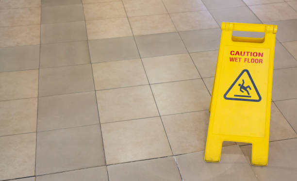 istock warning yellow plastic sign, caution wet floor 923246226