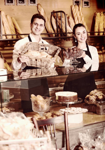 istock staff offering fancy and cakes 923246390