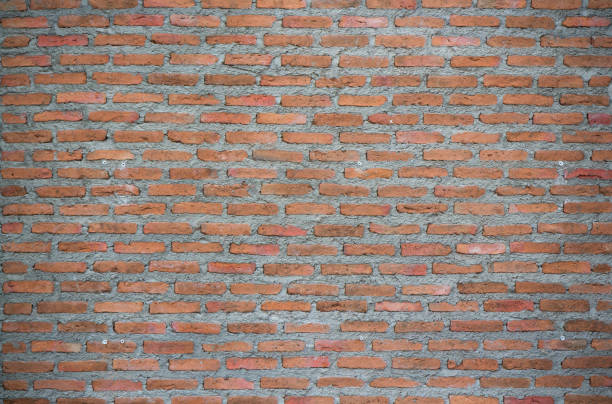 unfinished red brick wall with dark vignette - unfinish imagens e fotografias de stock