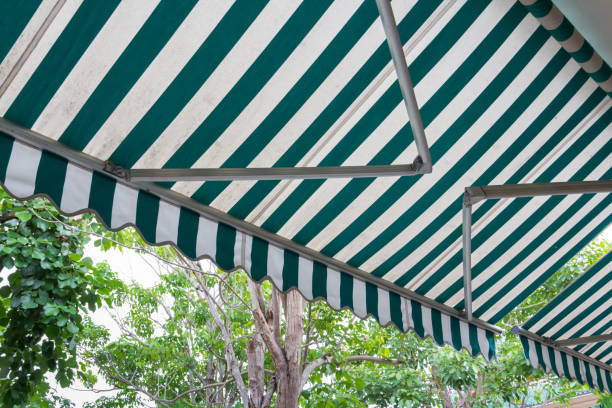 istock green and white stripe awning, automatic mechanic awning 923246626