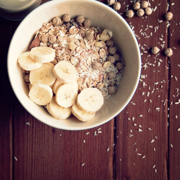 istock Granola bowl with banana, raisins and nuts closeup 923255344