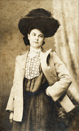 Vintage photograph of an elaborately dressed woman.