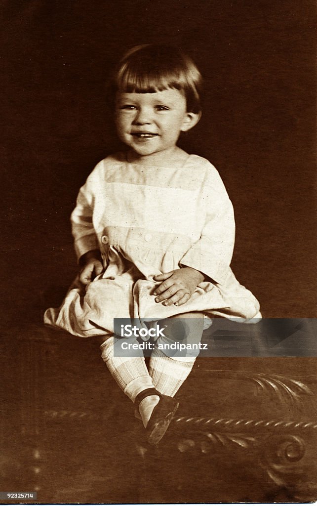smiling child A vintage photo of a smiling young girl.  Fiber paper photo. Antique Stock Photo