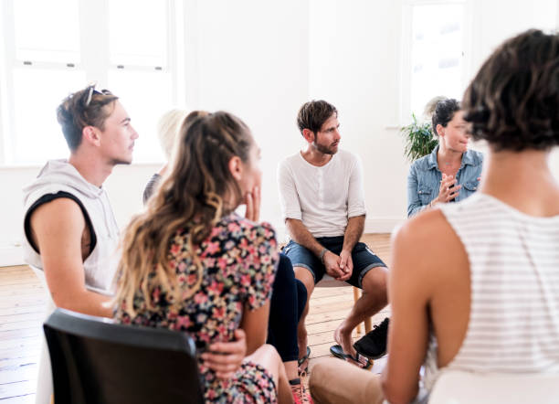istock People listening in group therapy session 923258800