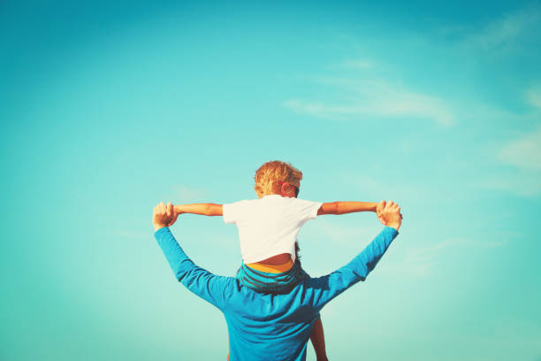 istock happy father and son having fun on sky 923259056
