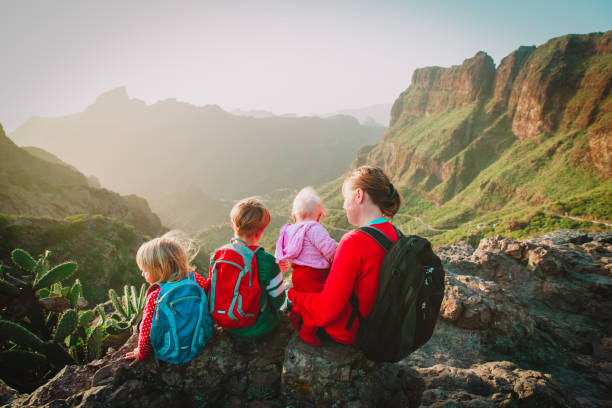 istock mother with three kids hiking in mountains 923259848