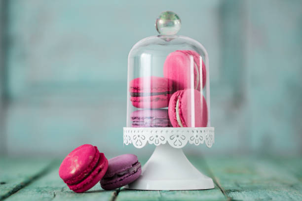 istock French cake macaroon on a wooden background. Colorful dessert 923262798