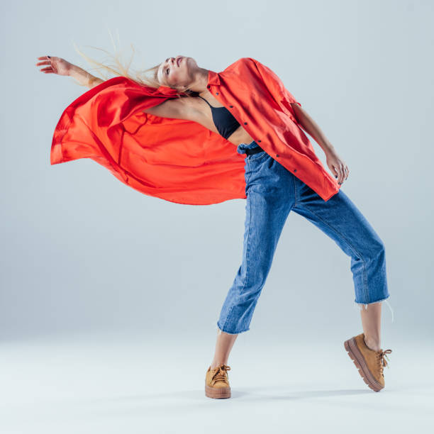 istock Young beautiful female dancer is posing in the studio 923266252