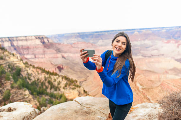 istock Woman taking selfies at Grand Canyon 923267040