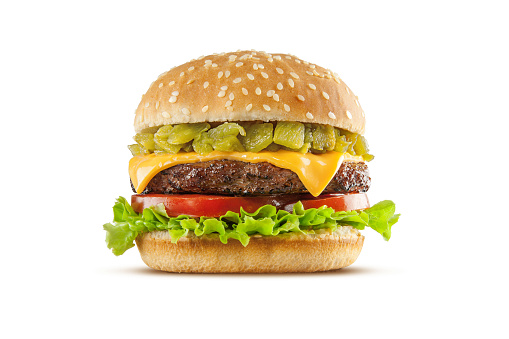 High resolution, digital capture of an American regional fast-food specialty, the New Mexico green chile cheeseburger. Made with roasted New Mexico Hatch green chile, American cheese, tomatoes, and lettuce, on a fresh sesame seed bun, and set against a clean, white background sweep. Shot in an aspirational advertising style.
