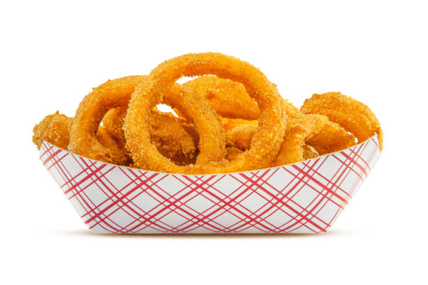 Onion Rings High resolution, digital capture of an order of fresh, crispy onion rings. Onion rings are sitting in a typical disposable fast food style paper basket, set against a pure white background. fried onion rings stock pictures, royalty-free photos & images