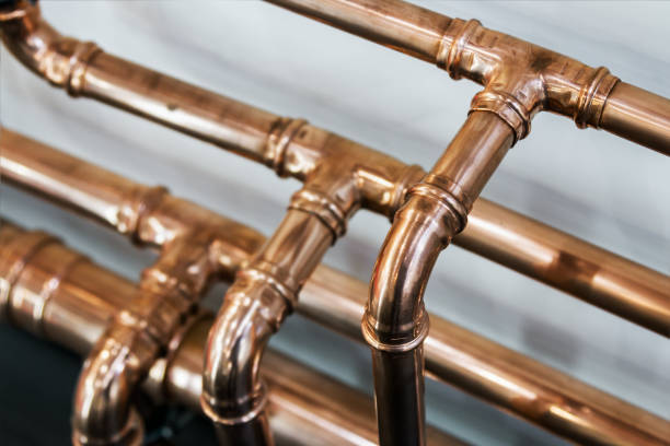 copper pipes and fittings for carrying stock photo
