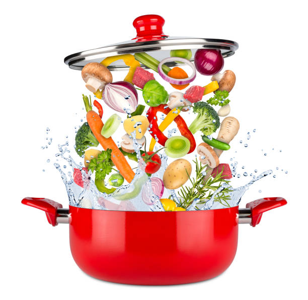 istock fresh ingredients falling flying into red cooking pot 923274066