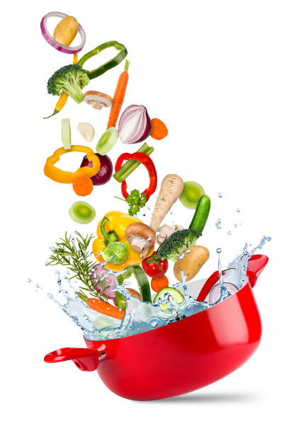 fresh ingredients falling flying into red cooking pot