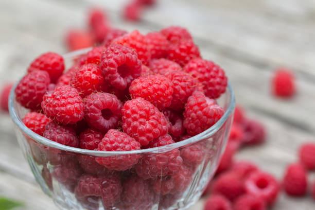 istock A glass of raspberry on a wooden table 923275854