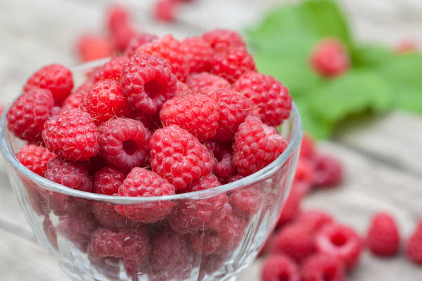 istock A glass of raspberry on a wooden table 923277784