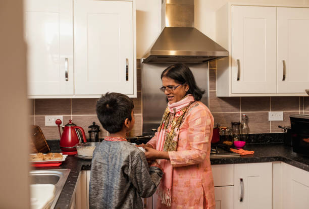 istock Helping his Grandmother in the Kitchen 923278010
