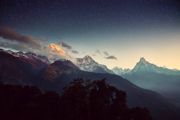 istock Night landscape on early morning. Starry sky with over the mountains. 923278768