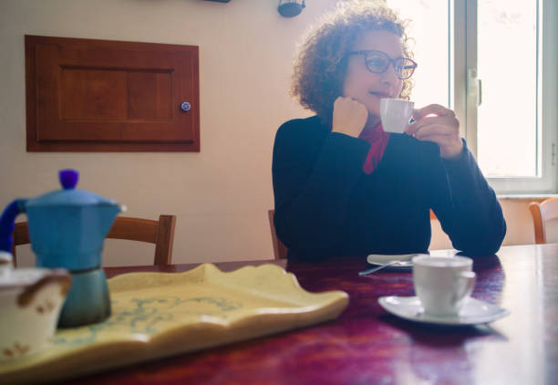 istock Woman drinking Coffee at Home 923279480