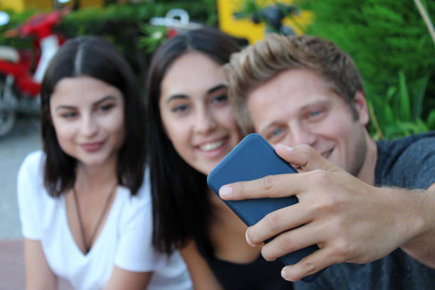 istock Group of friends making selfie 923297662