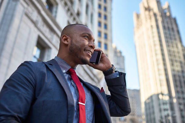 istock Businessman talking on his mobile phone in downtown Chicago 923304902