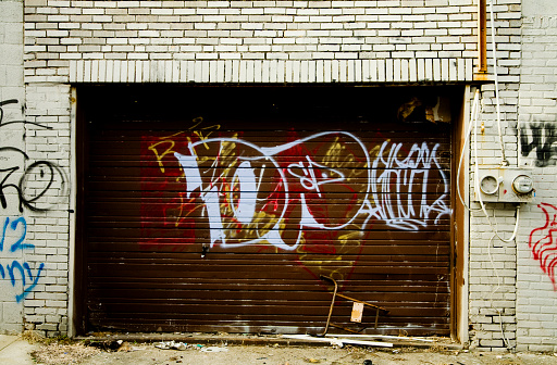 Graffiti on a wall and garage door