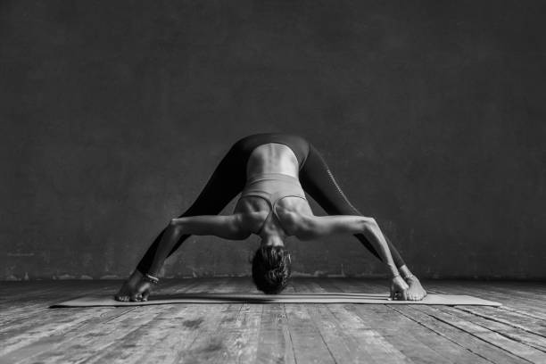 istock Young beautiful yoga female posing in studio 923308548