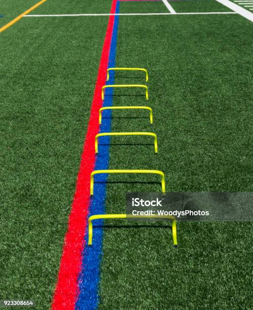 Six Yellow Mini Hurdles Lined Up For Speed Practice Stock Photo - Download Image Now
