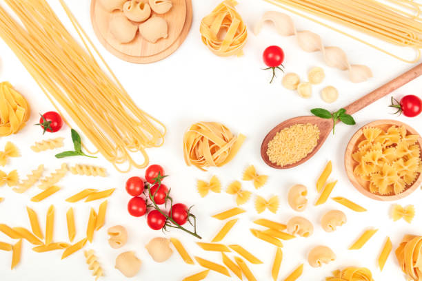 istock Overhead photo of different types of pasta on white, forming frame 923312734