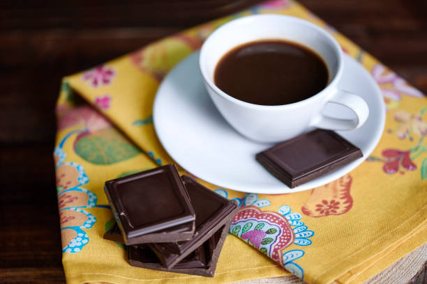 Defocused cup of coffee with chocolate