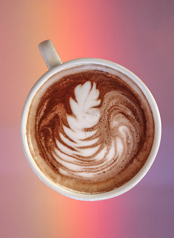 Composite image of a coffee drink on a rainbow.