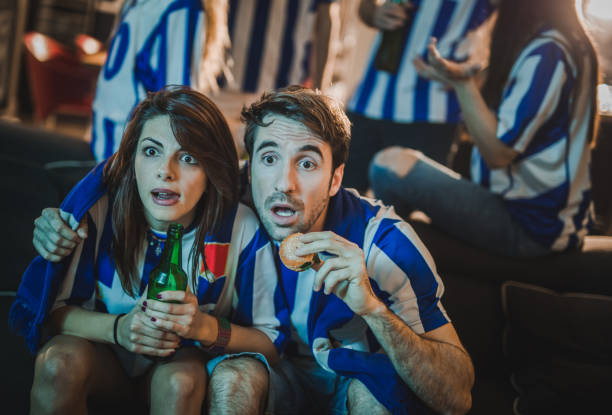 istock Anticipation during a championship game on TV! 923315478
