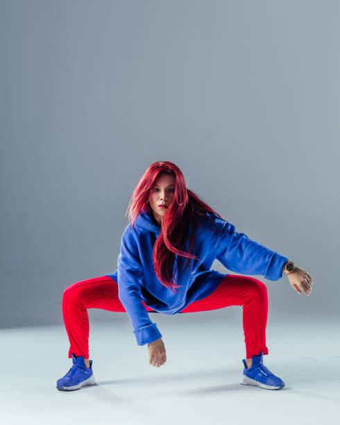 istock Young beautiful female dancer is posing in the studio 923316000