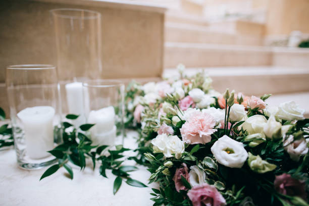 istock Rustic wedding decor, decorated stairs white candles and fresh flowers 923323298