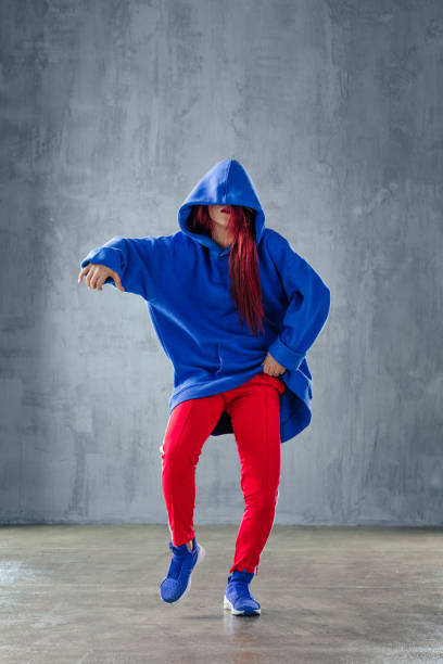 istock Young beautiful female dancer is posing in the studio 923330058