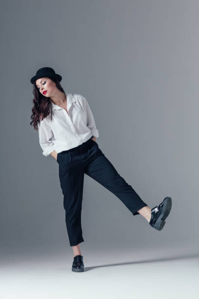 istock Young beautiful female dancer is posing in the studio 923333432