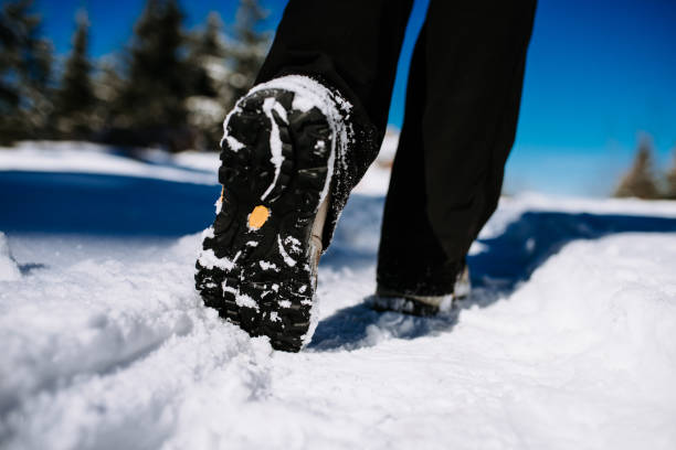 istock Steps in snow. Walking on a snowy mountain. 923333724