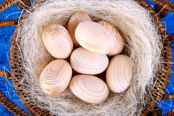 istock Easter wooden egg with in basket 923333796