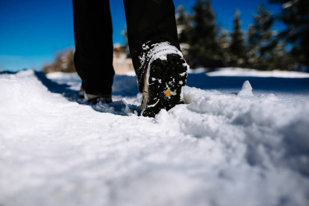 istock Hiking on the mountaintop covered with snow. Low angle view 923333832