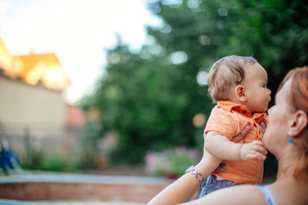 istock Mother holding baby 923334026